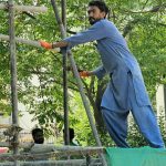 Labour working on building construction FREE STOCK IMAGE PAKISTAN
